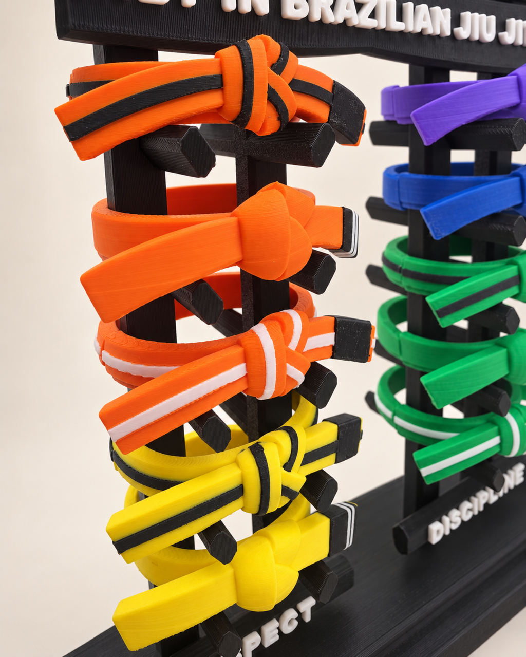 Close-up of orange and yellow BJJ belts