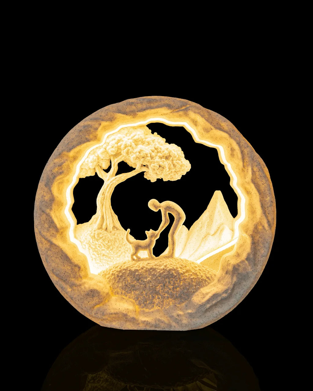 Best Friend Table Lamp illuminated from the front, showing a person greeting a cat beneath a tree