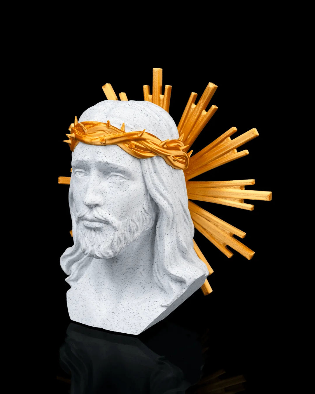 Holy Christ decor in marble and gold, angled view on a black background