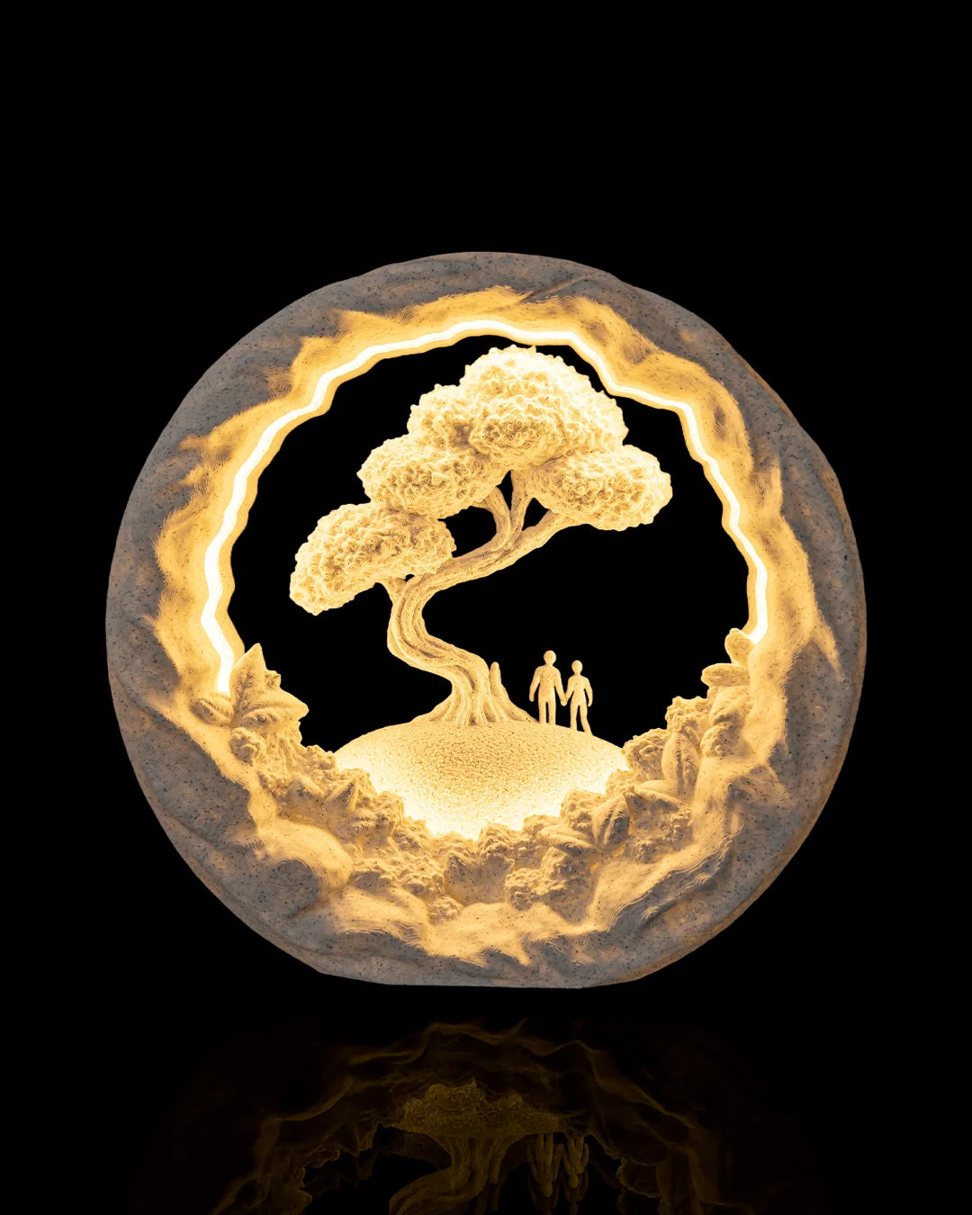 Our Journey Table Lamp illuminated from the front, showing two figures beneath a tree