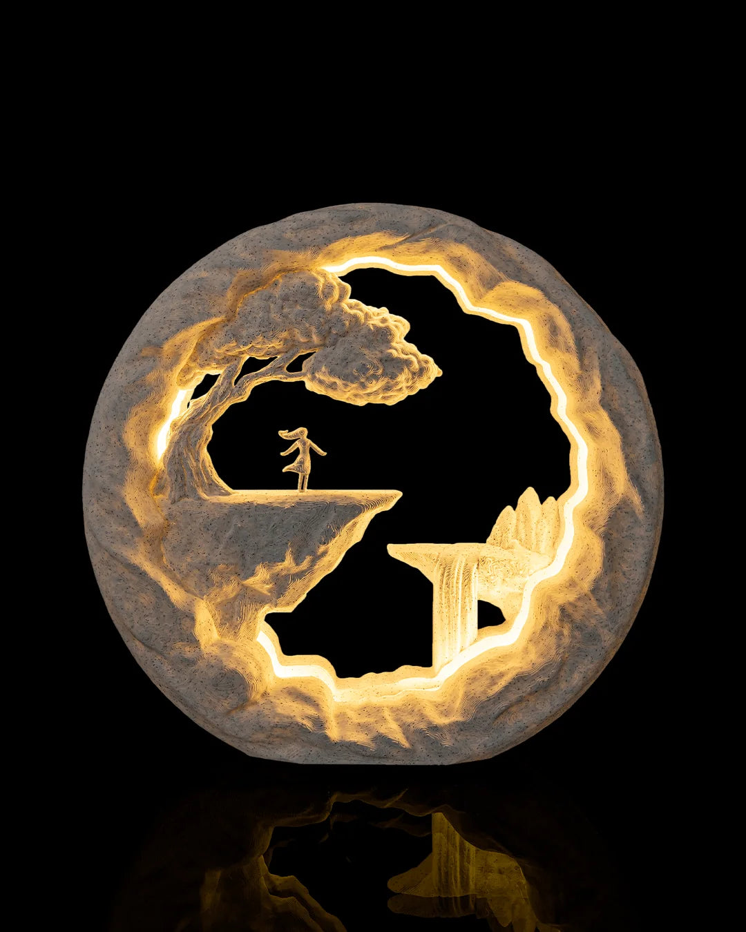 The Dreamer Table Lamp illuminated from the front, showing a figure at the edge of a cliff