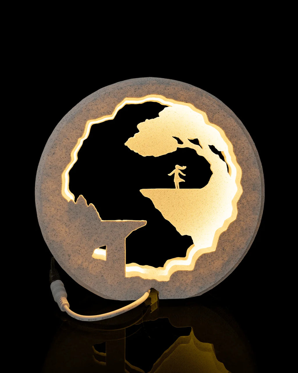 Rear view of The Dreamer Table Lamp illuminated with its power connection visible