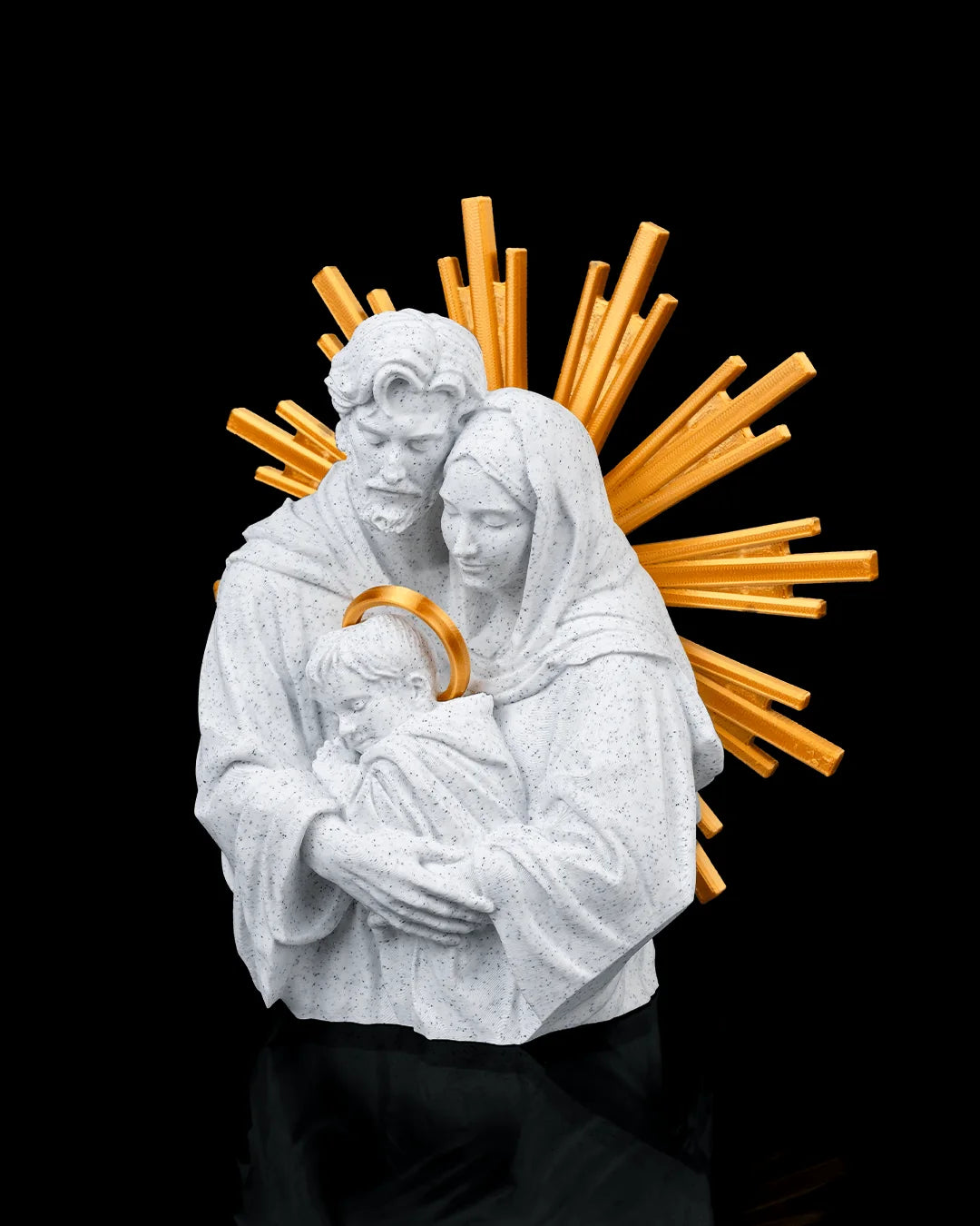 The Holy Family decor in marble and gold, angled view on a black background