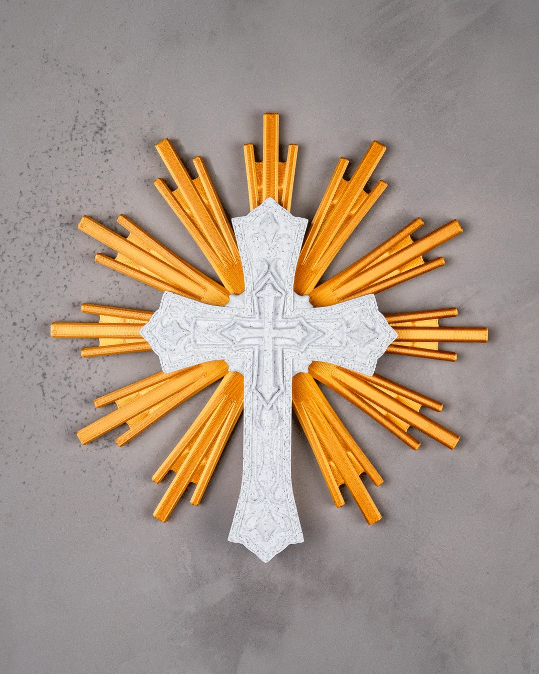 The Sacred Cross wall decor in marble and gold on a light gray wall