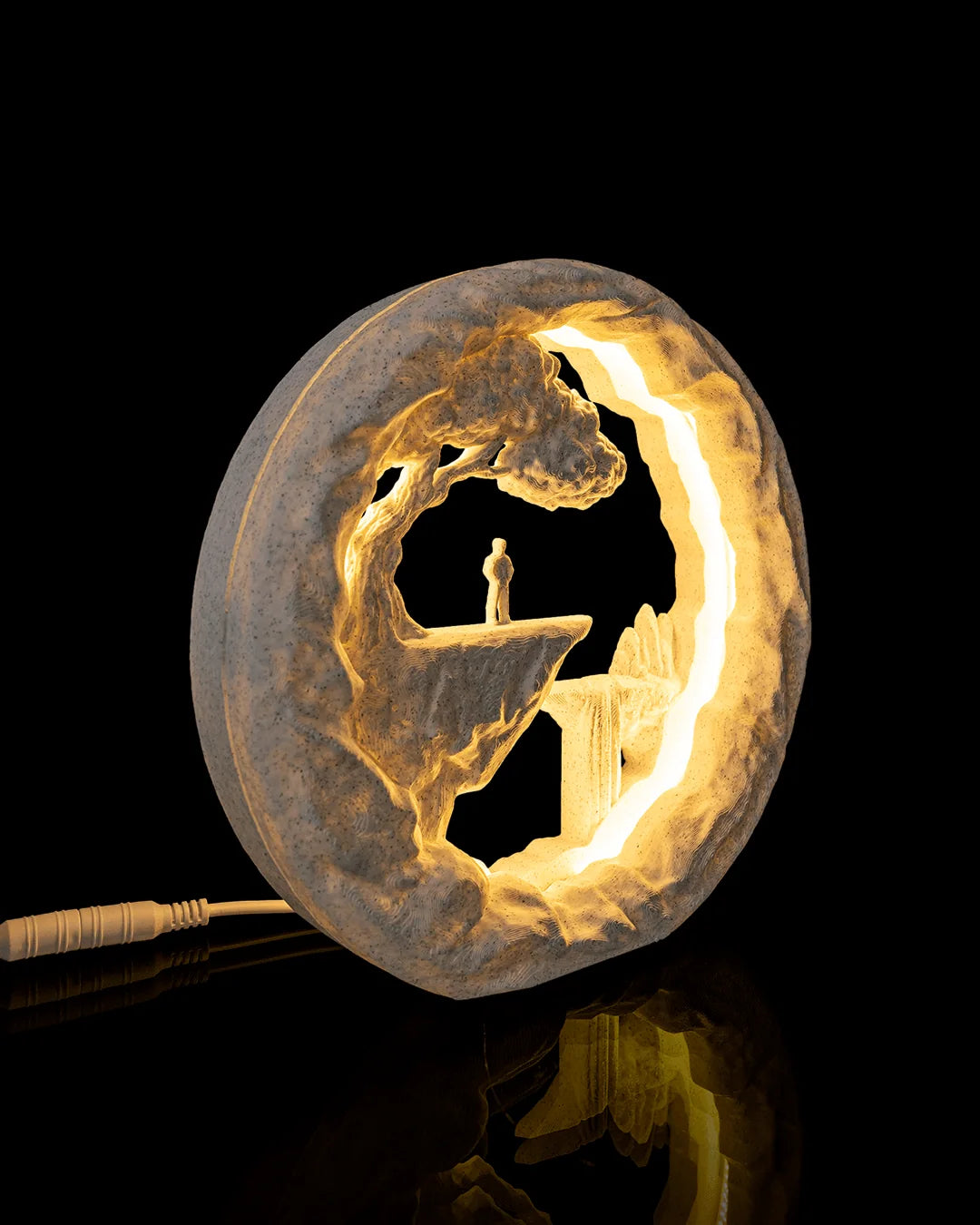 The Wanderer Table Lamp illuminated from a right angled view with the power cable visible