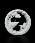 The Wanderer Table Lamp unlit, showing the landscape scene and white Marble finish